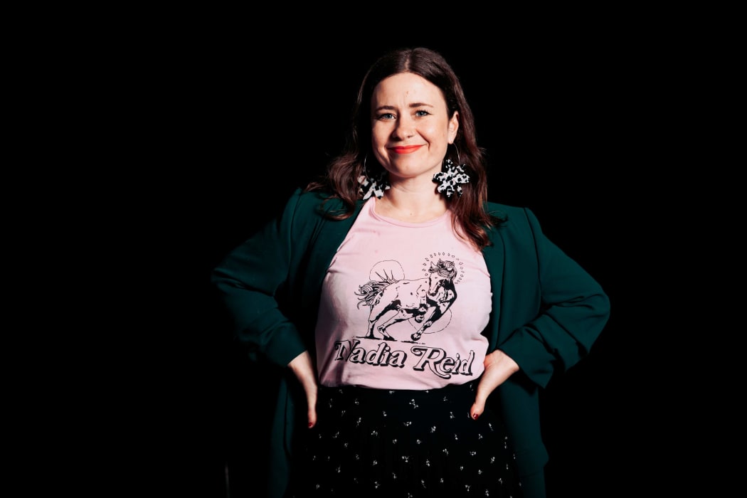 RNZ podcast host Melody Thomas in her Nadia Reid t-shirt