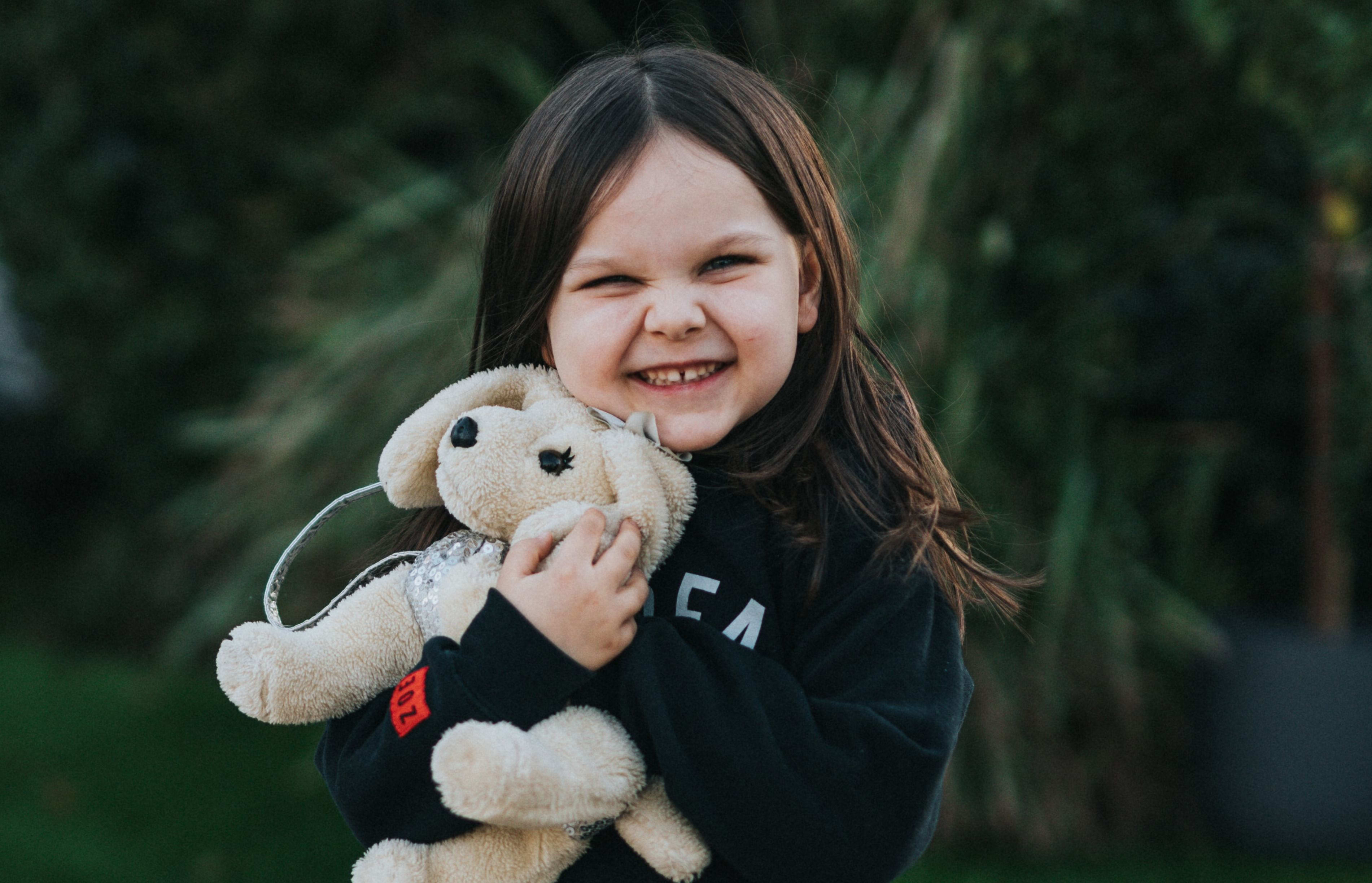 little girl with stuffed toy