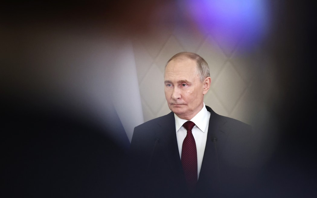 In this pool photograph distributed by the Russian state agency Sputnik, Russian President Vladimir Putin addresses the press after attending a meeting of the Collective Security Treaty Organization (CSTO) in Astana on November 28, 2024. - Russian President Vladimir Putin arrived in Kazakhstan on November 27, 2024 for a two-day trip aimed at shoring up ties with his Central Asian allies as tensions mount over the Ukraine war. Kazakhstan is a member of the Moscow-led CSTO security alliance but has expressed concern about the almost three-year conflict, which Kazakh President Kassym-Jomart Tokayev has refused to condone. (Photo by Mikhail TERESHCHENKO / POOL / AFP)