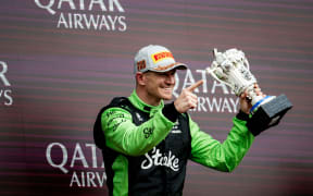 Nico Hulkenberg holds up his LEGO trophy after finishing third in the British Grand Prix at Silverstone in England, 6 July, 2025.  Photo Alberto Vimercati / DPPI