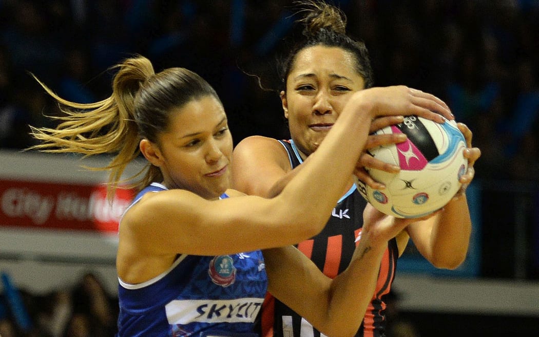 Erikana Pedersen and Kayla Cullen (L) tussle for the ball.