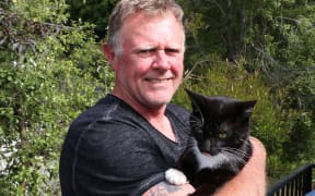 Henry the cat and Greg Johns.