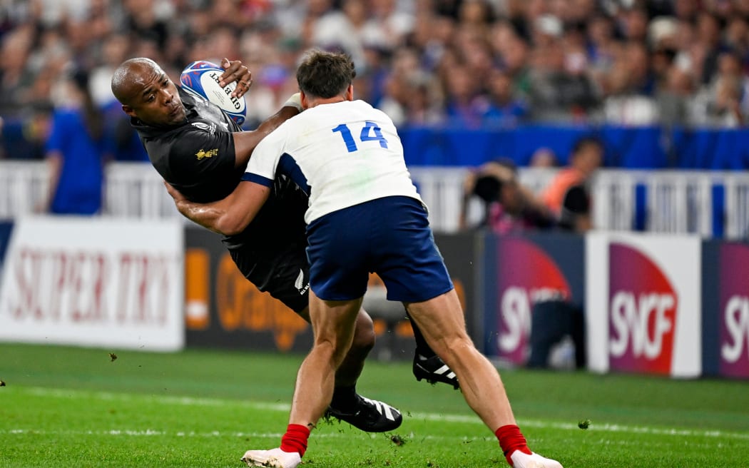 Mark Telea of New Zealand tackled by Damian Penaud of France. Rugby World Cup France 2023, France v New Zealand All Blacks pool match at Stade de France, Saint-Denis, France on Friday 8 September 2023. Mandatory credit: Andrew Cornaga / www.photosport.nz