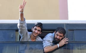 A bus carrying Palestinians released from Israeli prisons under a Gaza ceasefire and hostage exchange deal with Palestinian factions, arrives outside the Nasser hospital in Khan Yunis in the southern Gaza Strip on October 13, 2025. (Photo by Omar AL-QATTAA / AFP)