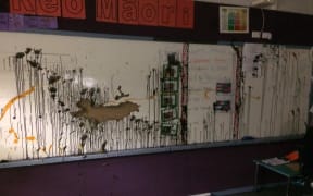 Paint throw at a wall at Te Kura Kaupapa Maori o Kaikohe.