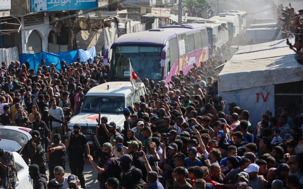 Buses carrying Palestinians released from Israeli prisons under a Gaza ceasefire and hostage exchange deal with Palestinian factions, arrive outside the Nasser hospital in Khan Yunis in the southern Gaza Strip on 13 October, 2025.