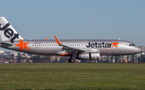 Sydney, Australia - May 5, 2014: Jetstar Airways Airbus A320 airliner landing at Sydney Airport.