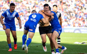 NZ Kiwis centre Joseph Manu gets his jersey ripped off during the New Zealand Kiwis  v Toa Samoa.