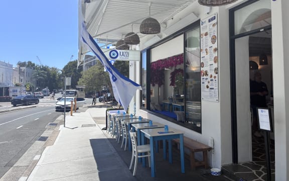 Kazzi Beach Greek at Bondi Beach displays an Israeli flag following the Bondi Beach attack.
