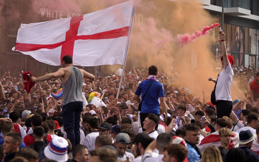 England fans cheer on their team outside Wembley Stadium ahead of the UEFA EURO 2020 final football match between England and Italy