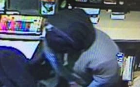 CCTV images of the robbers, who demanded cash at TAB in Merivale.