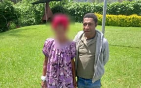 Dickson Tanda with one of the many women he rescued.