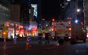 Firefighters at the Commercial Bay complex on Auckland's waterfront after fire broke out on the 22nd floor.