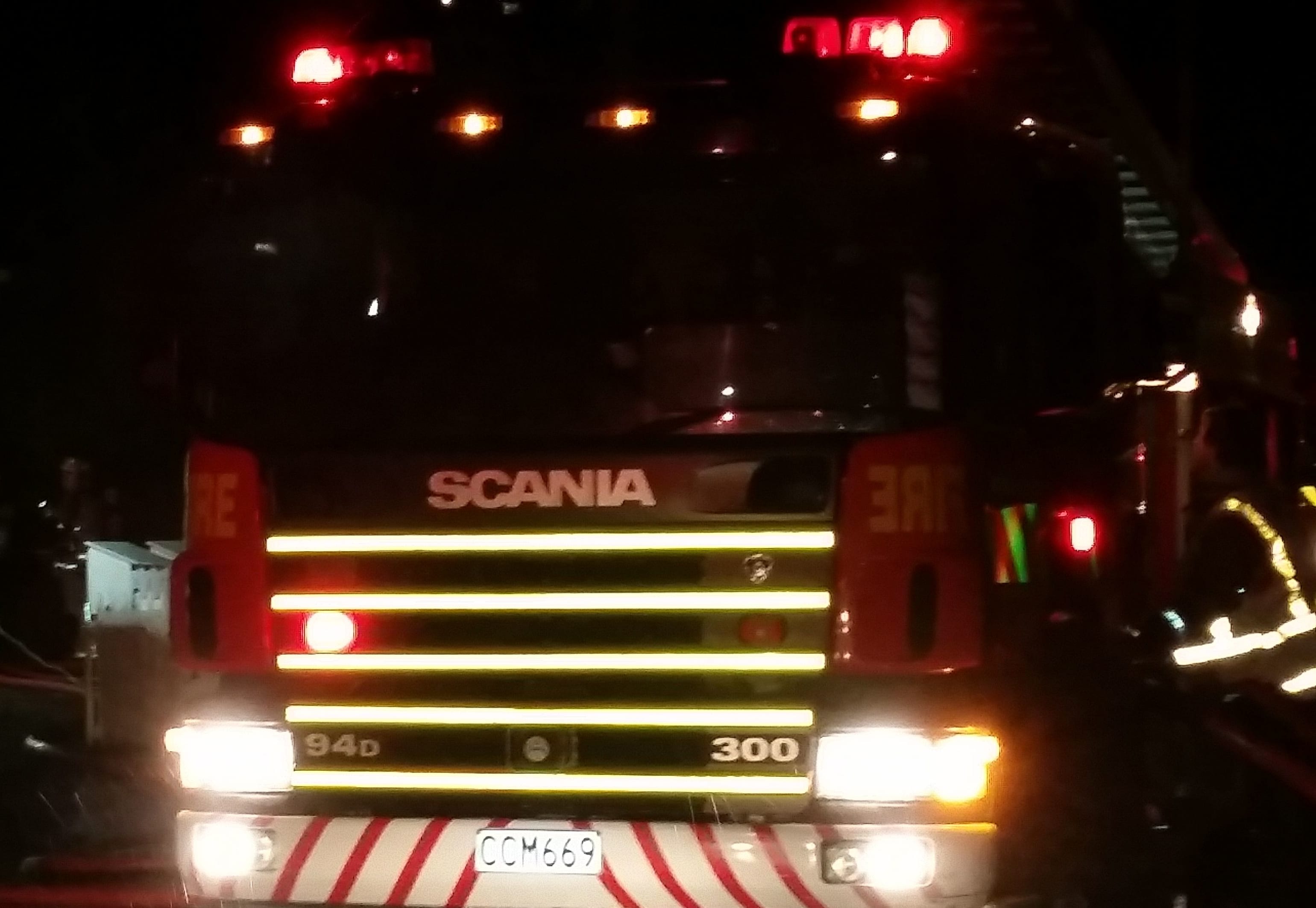 Fire engines fight the blaze at a two-story block of flats in Johnsonville, Wellington