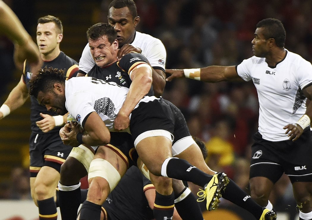 Wales captain Sam Warburton challenges Fiji wing Metuisela Talebula during their World Cup pool clash at the Millennium Stadium in Cardiff.