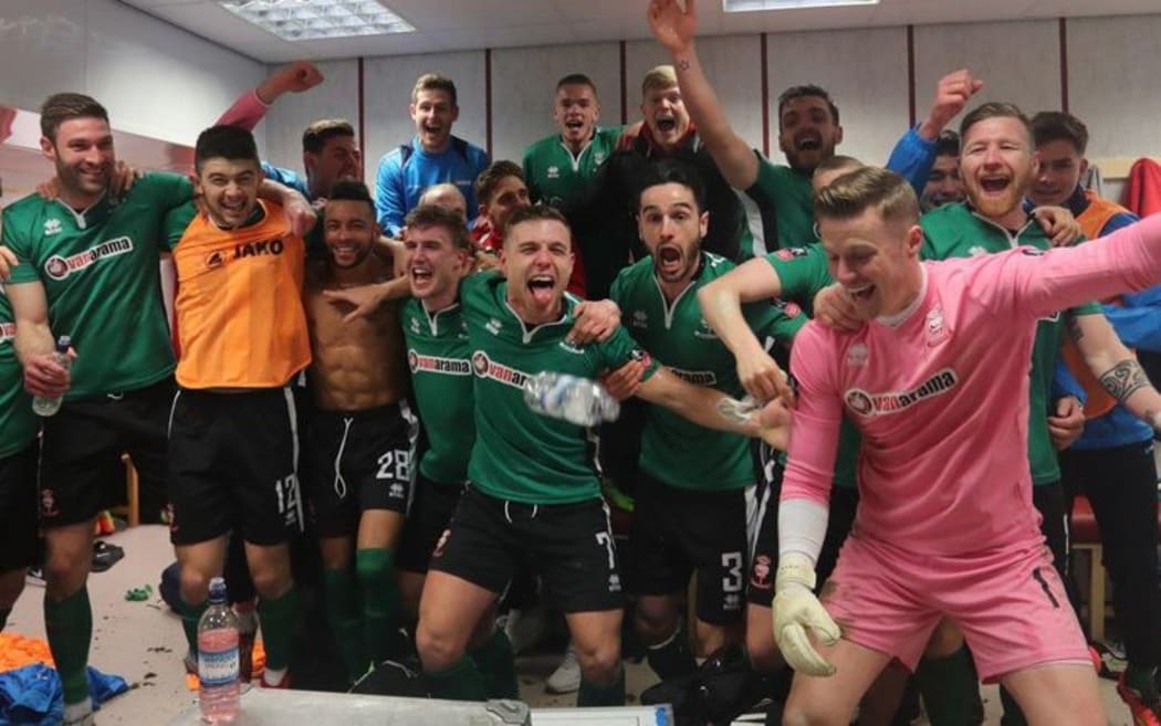 Lincoln City celebrate their shock win over Premiership side Burnley.