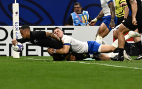 Aaron Smith scores one of his tries in the Rugby World Cup pool match against Italy at Lyon.