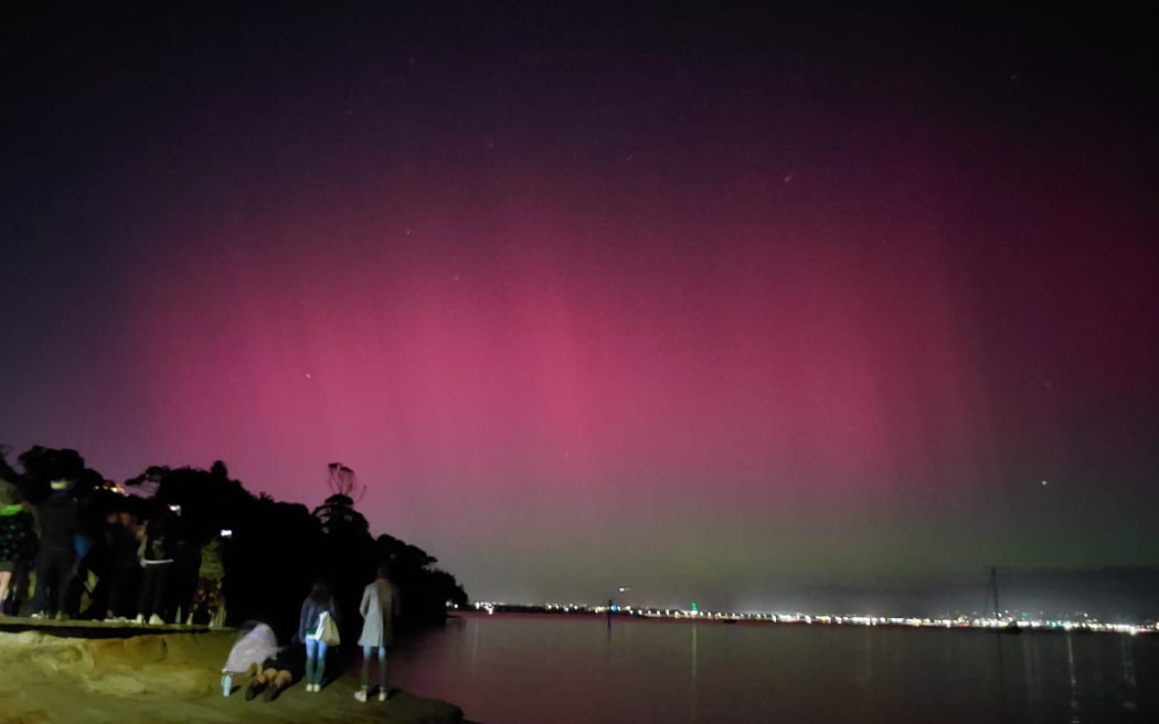 The aurora seen from Island Bay in Beach Haven, Auckland, on 11 May, 2024.