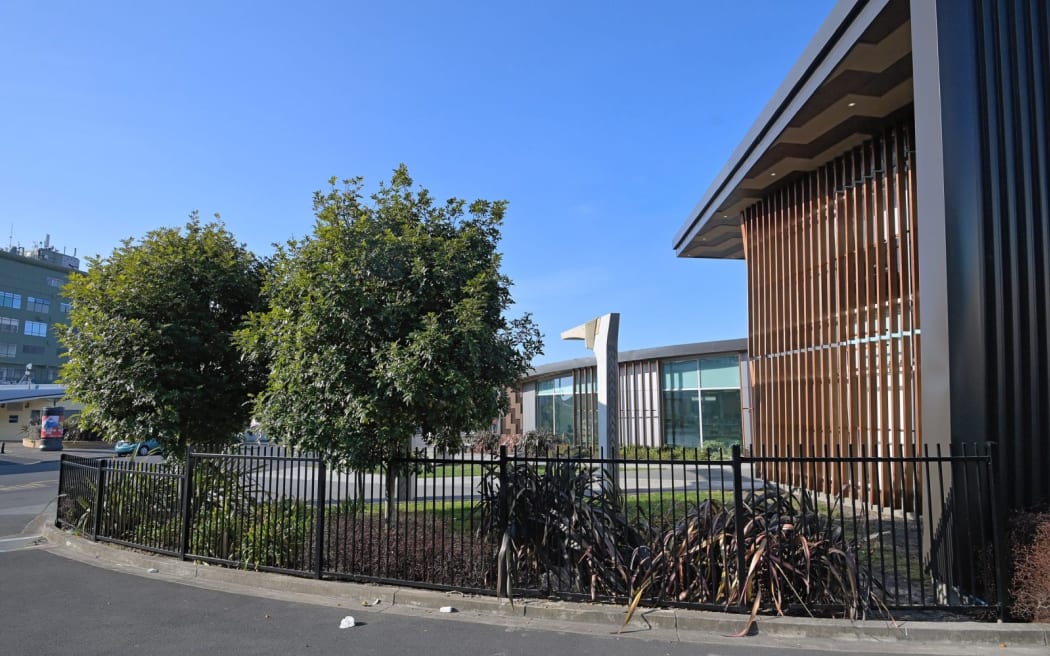 Gisborne District Council says the black metal railing fence has been put up to encourage pedestrians to use even surfaces when accessing the library, as well as to protect the building and plants. Some library patrons are objecting to their shortcut being blocked.