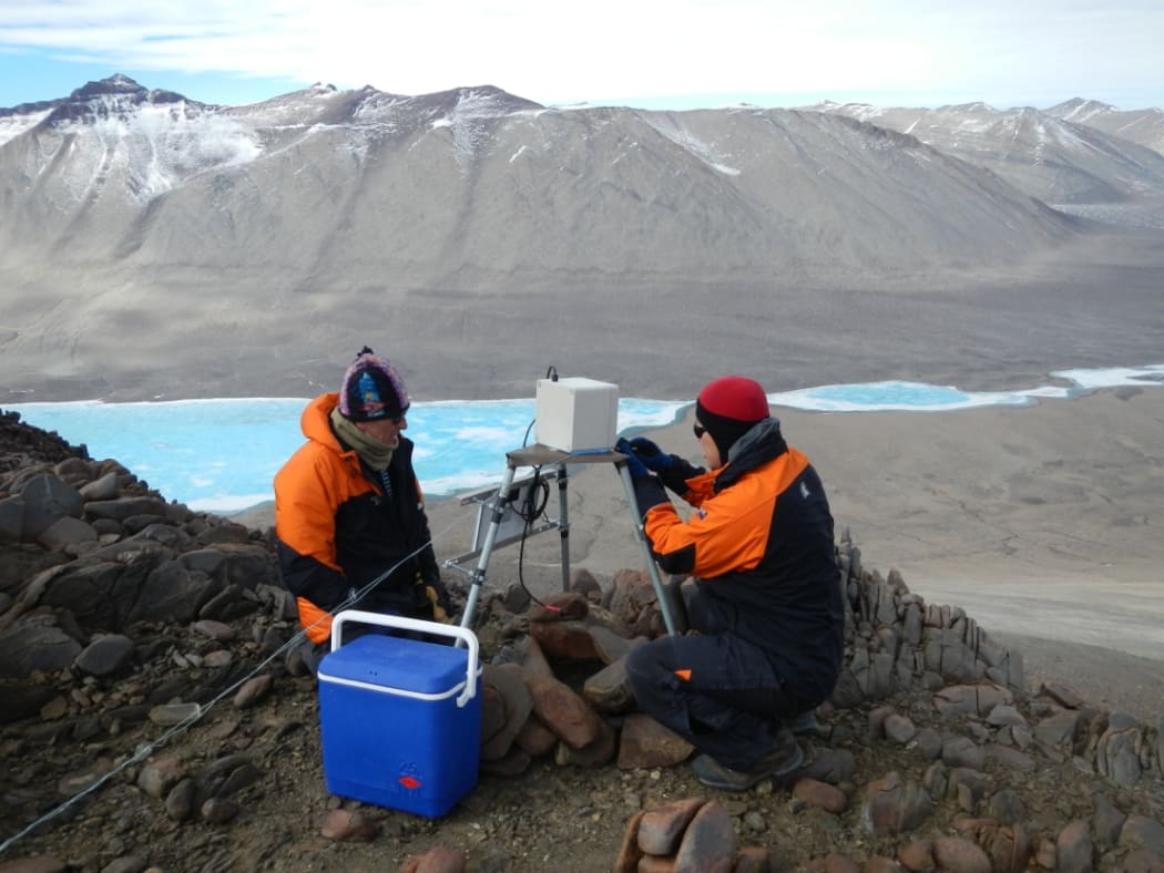 Waikato University's Craig Cary and Charles Lee installing a time lapse camera in Victoria Valley, one of the McMurdo Dry Valleys.