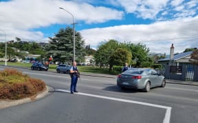 Armed police outside Bayfield High School, Dunedin, on 14 November 2023.