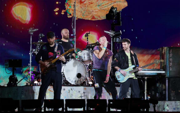 Coldplay with lead singer Chris Martin performing at the National Stadium, the first night of the band’s six concerts, 23 January 2024. The Singapore shows are the band’s longest Asian stint in their Music Of The Spheres world tour. (Photo by Gin Tay / ST / SPH Media via AFP)
