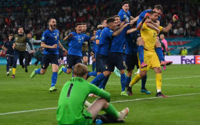 Italy's goalkeeper Gianluigi Donnarumma (R) and teammates celebrate after winning the UEFA EURO 2020 final football match between Italy and England at the Wembley Stadium