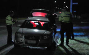 A car stopped by police in Manawatū.