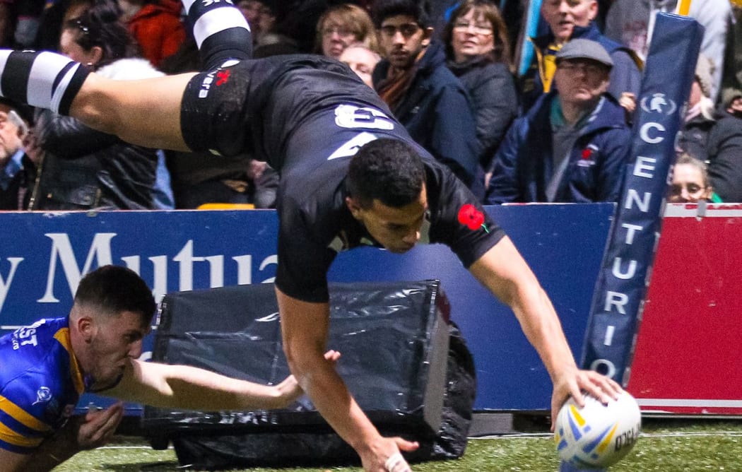 New Zealand's Jordan Kahu scores a try.