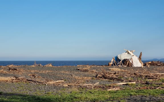 A man whose Esk Valley home was flooded was living in a shack on the Napier shore line.