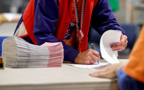 NORTH LAS VEGAS, NEVADA - NOVEMBER 10: Ballots are processed by election workers at the Clark County Election Department during the ongoing election process on November 10, 2022 in North Las Vegas, Nevada. Two days after midterm elections Nevada election officials continue counting votes in state races.   Mario Tama/Getty Images/AFP (Photo by MARIO TAMA / GETTY IMAGES NORTH AMERICA / Getty Images via AFP)