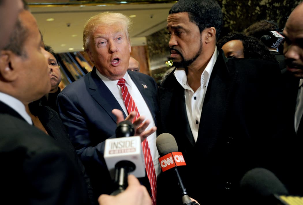 Republican presidential candidate Donald Trump talks to reporters after meeting with African-American religious leaders in New York in November 2015.