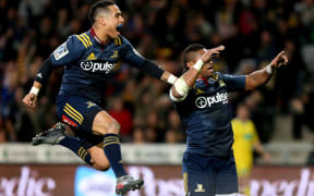 Aaron Smith jumps Waisake Naholo in delight.