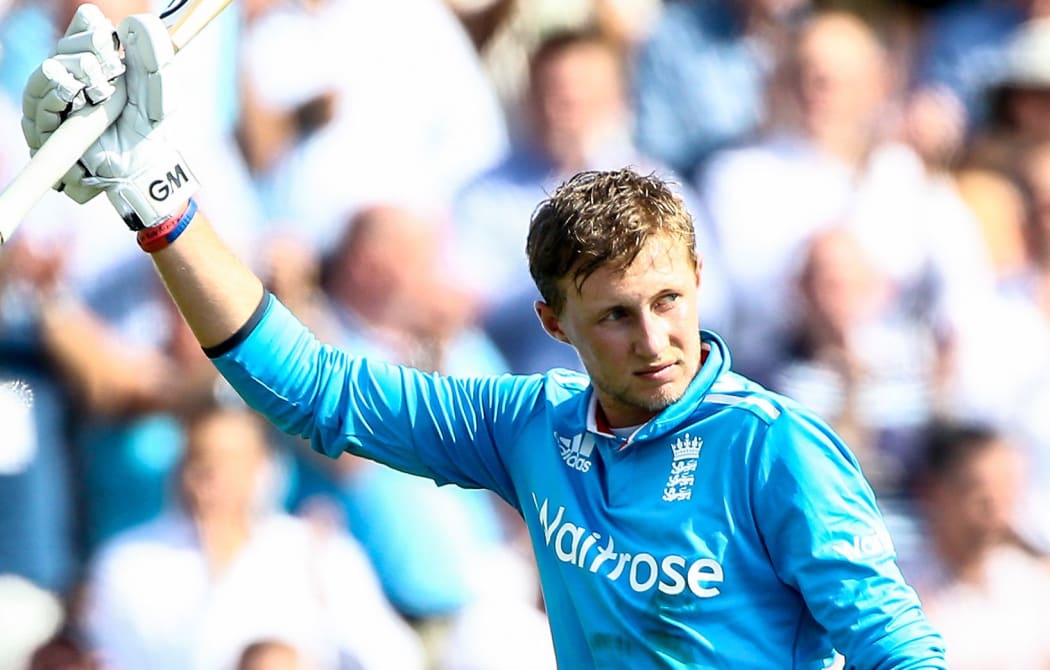 England cricketer Joe Root raises his bat.