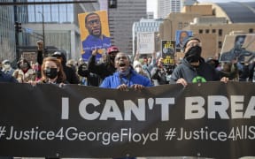 Protesters march through the city during a protest called "All Eyes on Justice", which was a protest created for the purpose of reminding the judge and influencers that there still is eyes on the trial in Minneapolis, Minnesota, United States on March 28, 2021.