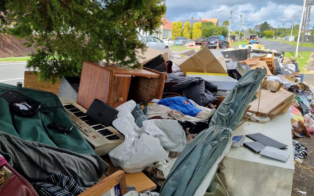 Household items still wait on the kerbside in Auckland's Mount Roskill.