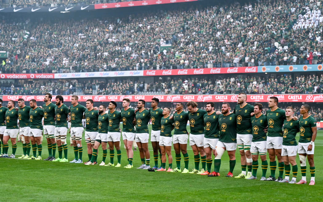 Springboks players listen to the national anthem.