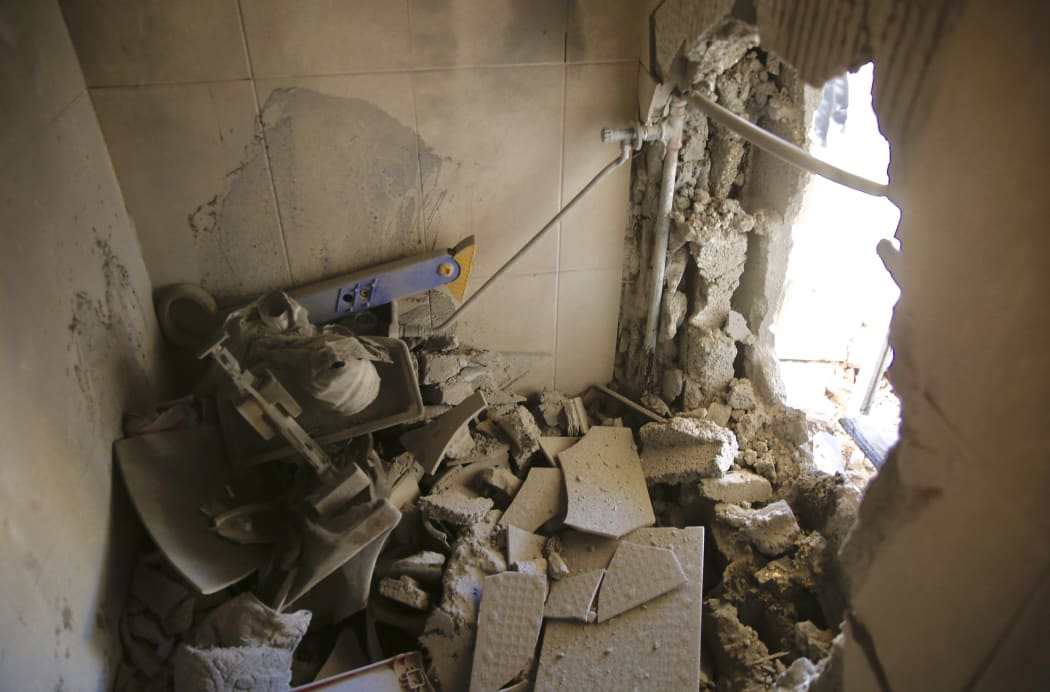 A damage to a house is seen after a rocket fired from Gaza Strip hit in the southern Israeli city Kiryat Gat, Israel, Saturday, May 4, 2019.