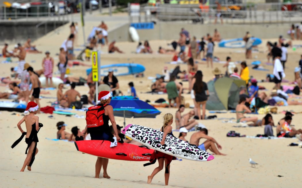 People enjoying Bondi Beach in Sydney on December 22, 2021.