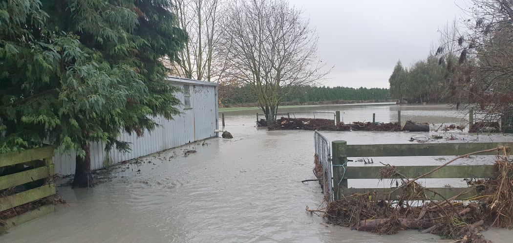 The exterior of the Williams family property remains submerged in floodwater.