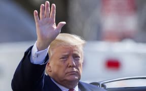 US President Donald J. Trump gestures after attending services at St. John's Episcopal Church in Washington, DC, USA