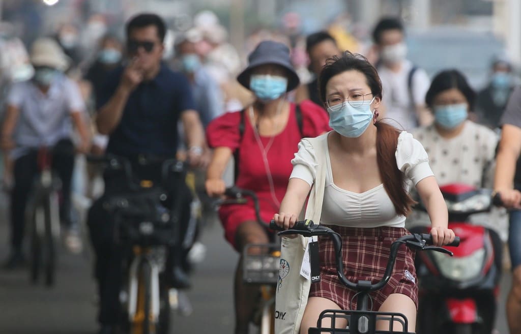 People wearing face mask are seen during commuting time in Beijing, China on July 30, 2020, amid continuing worries over the novel coronavirus COVID-19.   ( The Yomiuri Shimbun )