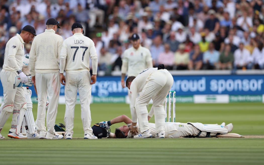 Steve Smith is struck on the neck and felled by a Jofra Archer bouncer during the 2nd Ashes Test Match between England and Australia at Lord's Cricket Ground on 17th August 2019.