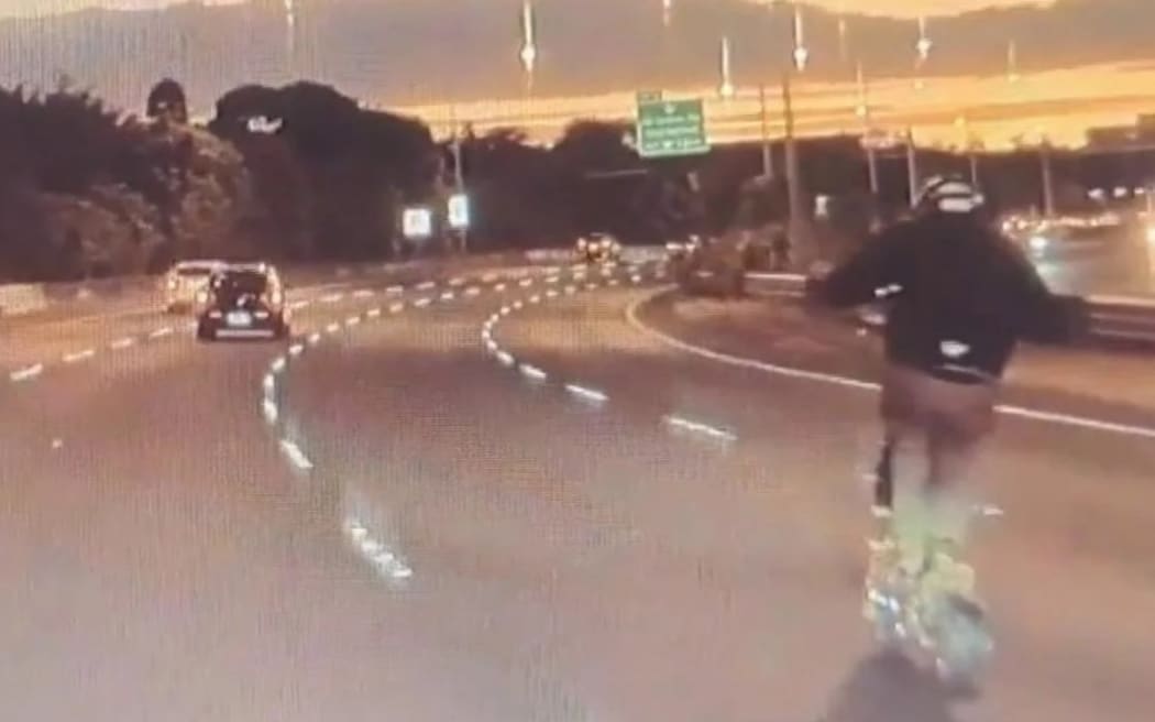 The e-scooter rider may have been breaking the 80kph speed limit on the Northwestern Motorway near St Lukes in Auckland.