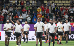 Fiji wave to the crowd after their final Rugby World Cup pool match against Wales.