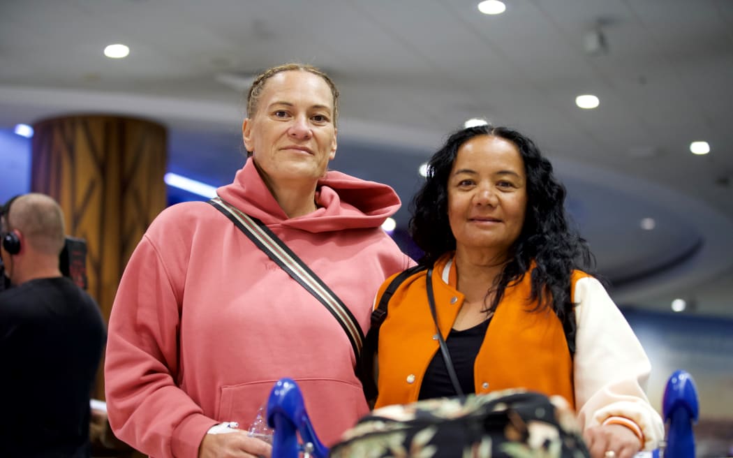 Some of the passengers on the special flight out of New Caledonia, after they had landed at Auckland Airport.