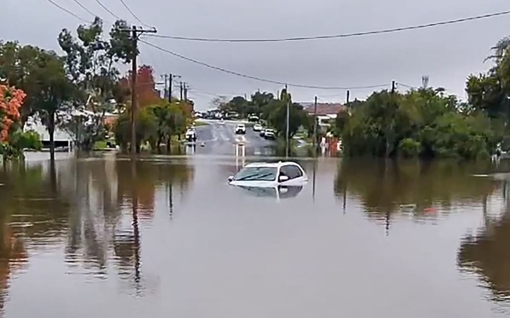 A car submerged in a flooded area in the New South Wales town of Taree.