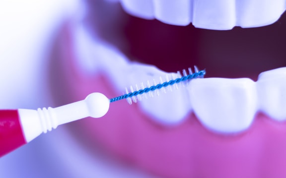 Inter dental teeth cleaning brush healthy floss action between each tooth to remove plaque.