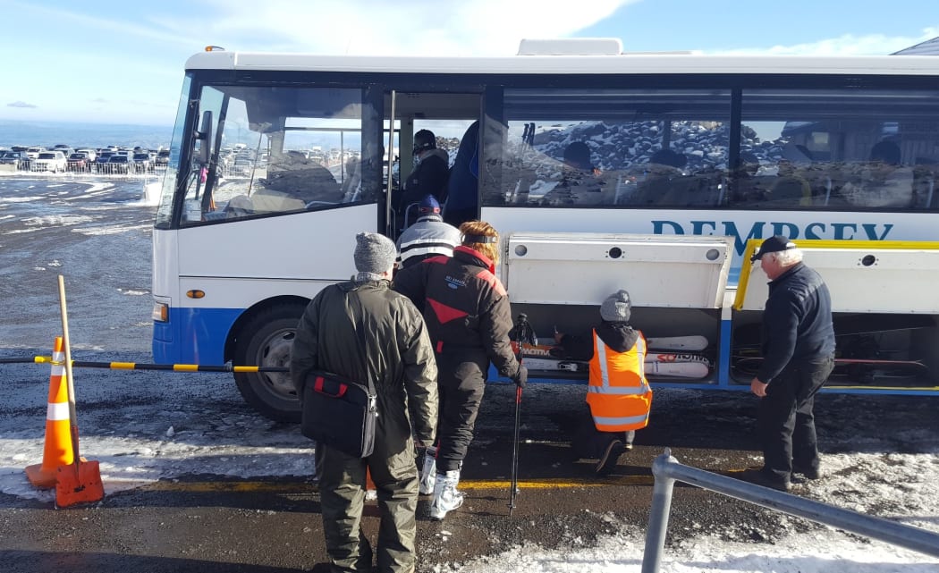 Snow seekers getting on replacement buses.