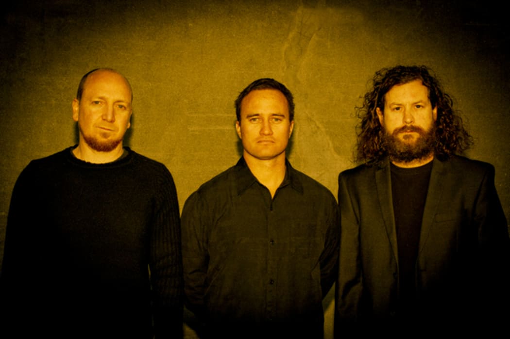 Jeff Boyle (guitar), Jason Johnston (drums), and Maurice Beckett (bass).